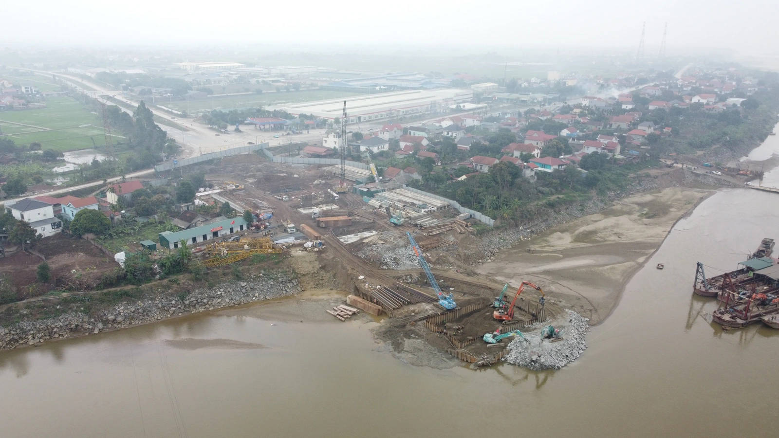 At the Construction Site of the New Phong Chau Bridge