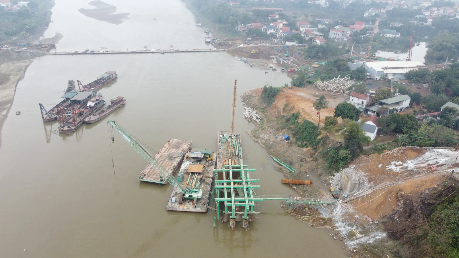 At the Construction Site of the New Phong Chau Bridge