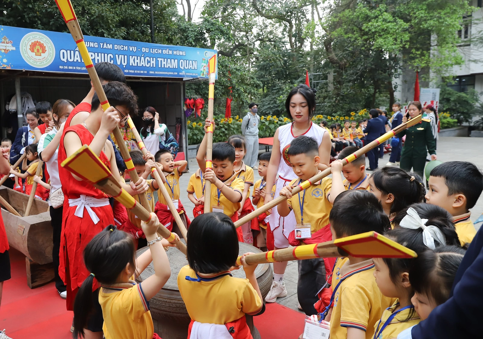 Bronze drum beating and bamboo pole stabbing performances for Hung Kings Commemoration Day