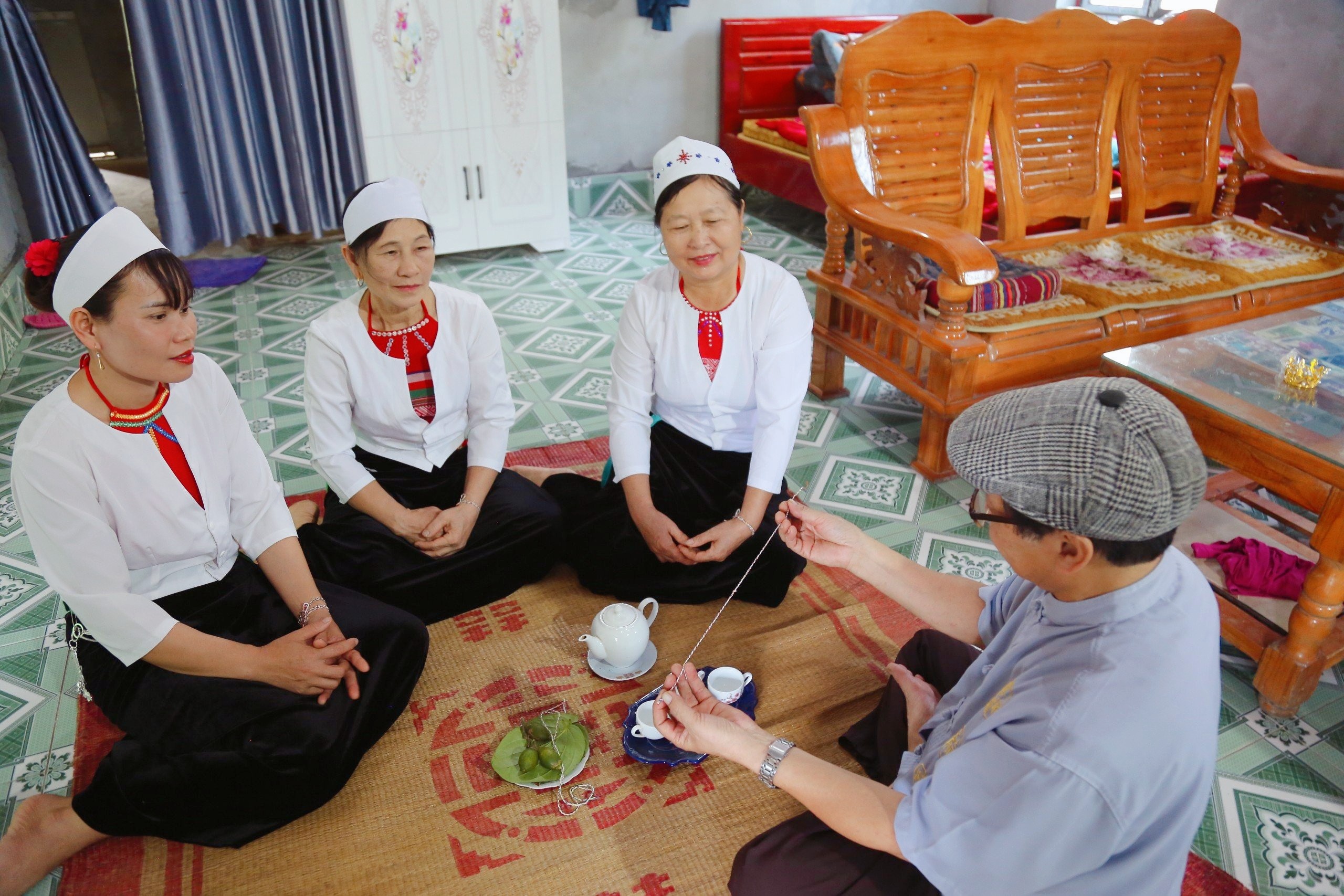 The Muong peoples thread tying around their wrists rituals