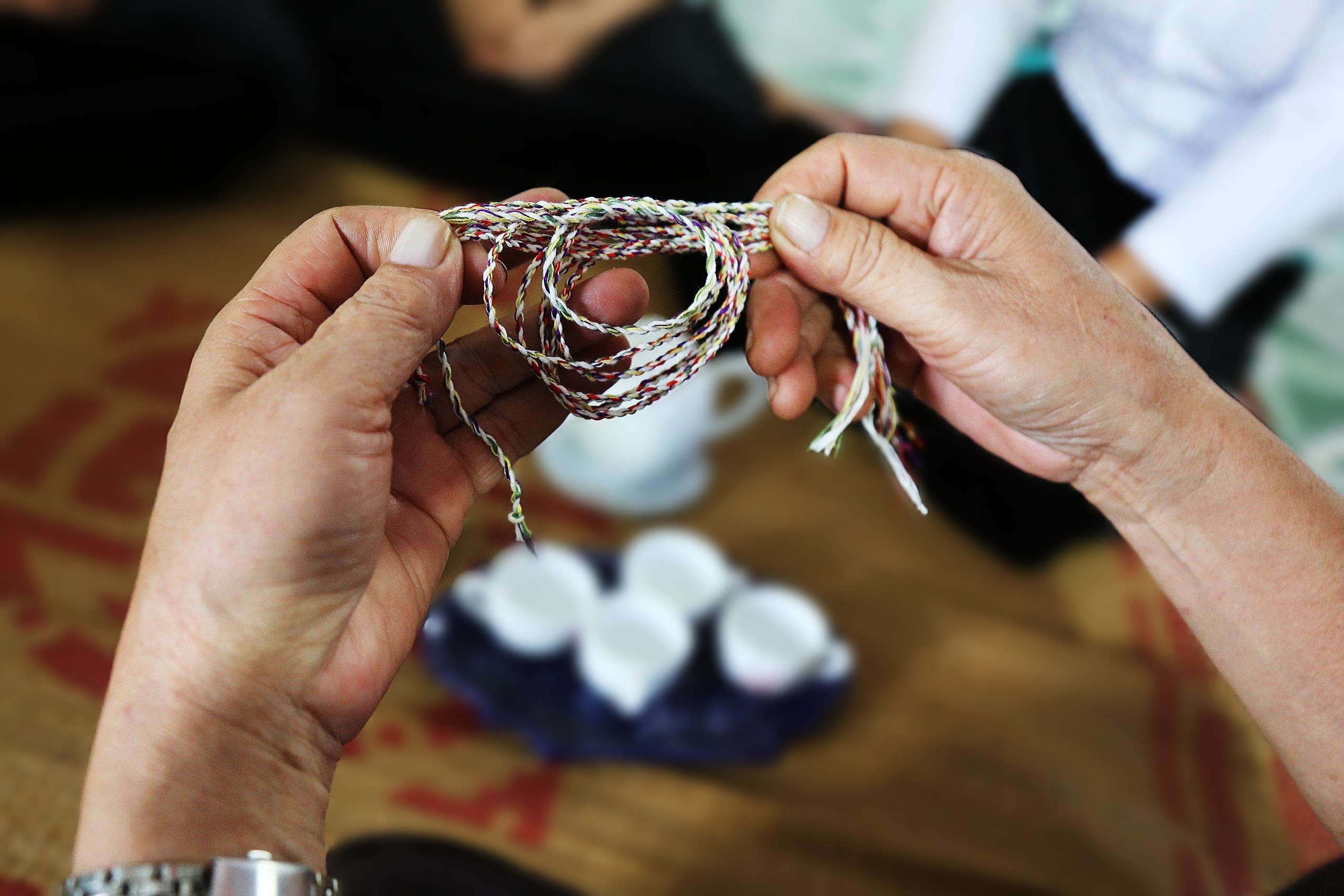 The Muong peoples thread tying around their wrists rituals