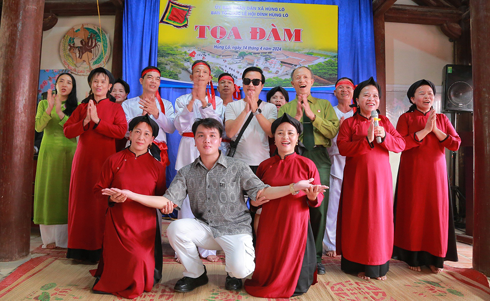 Performing ancient village Xoan singing at cultural relic sites