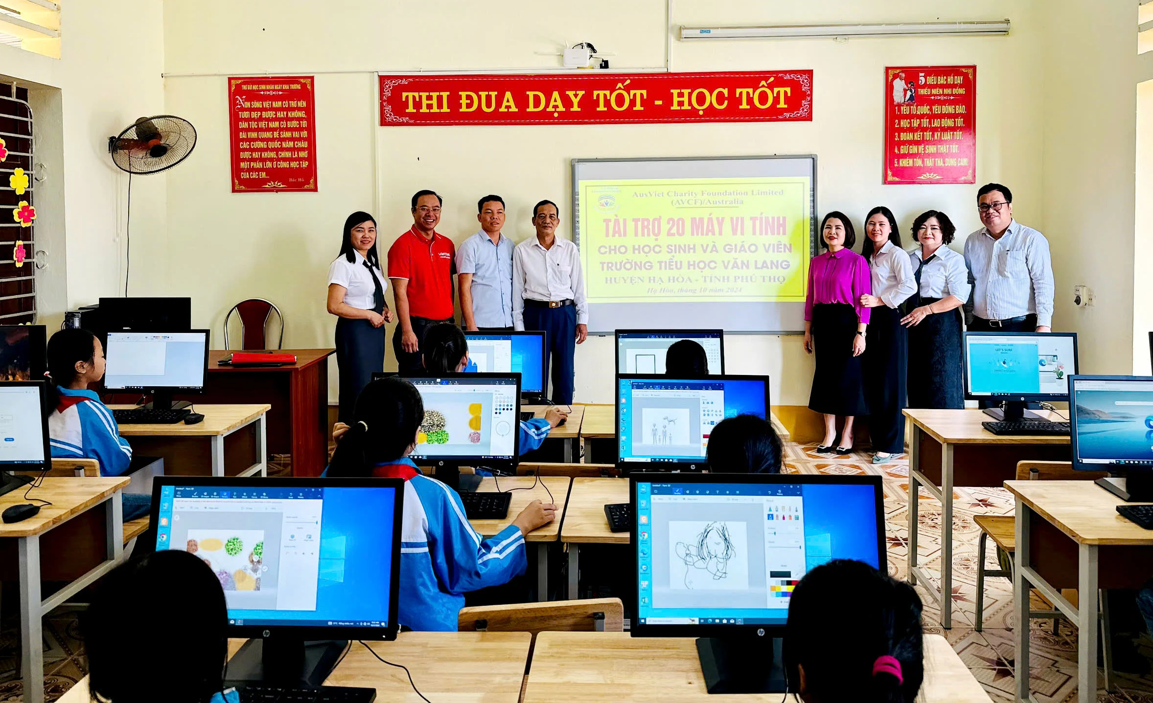 Handing over 55 computers sponsored by AVCF to the education sector in Ha Hoa