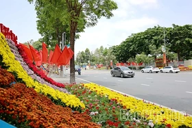 A Vibrant Display of Flags and Flowers to Celebrate April 30 and May 1